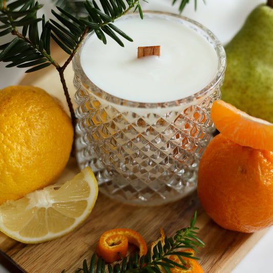Wooden-wick Asian scented candle with citrus lemons, mandarin and Japanese Hinoki cypress branches.