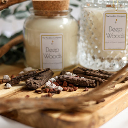 Eucalyptus leaves, Wood chips and Amber laid out on a wooden board for Masculine Fragrance Scented Candles
